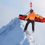 Lindsey Vonn crashing during the 2026 Winter Olympics downhill event at Milan Cortina, suffering a complex tibia fracture.