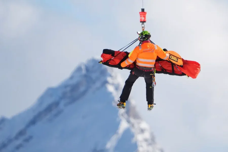 Lindsey Vonn crashing during the 2026 Winter Olympics downhill event at Milan Cortina, suffering a complex tibia fracture.